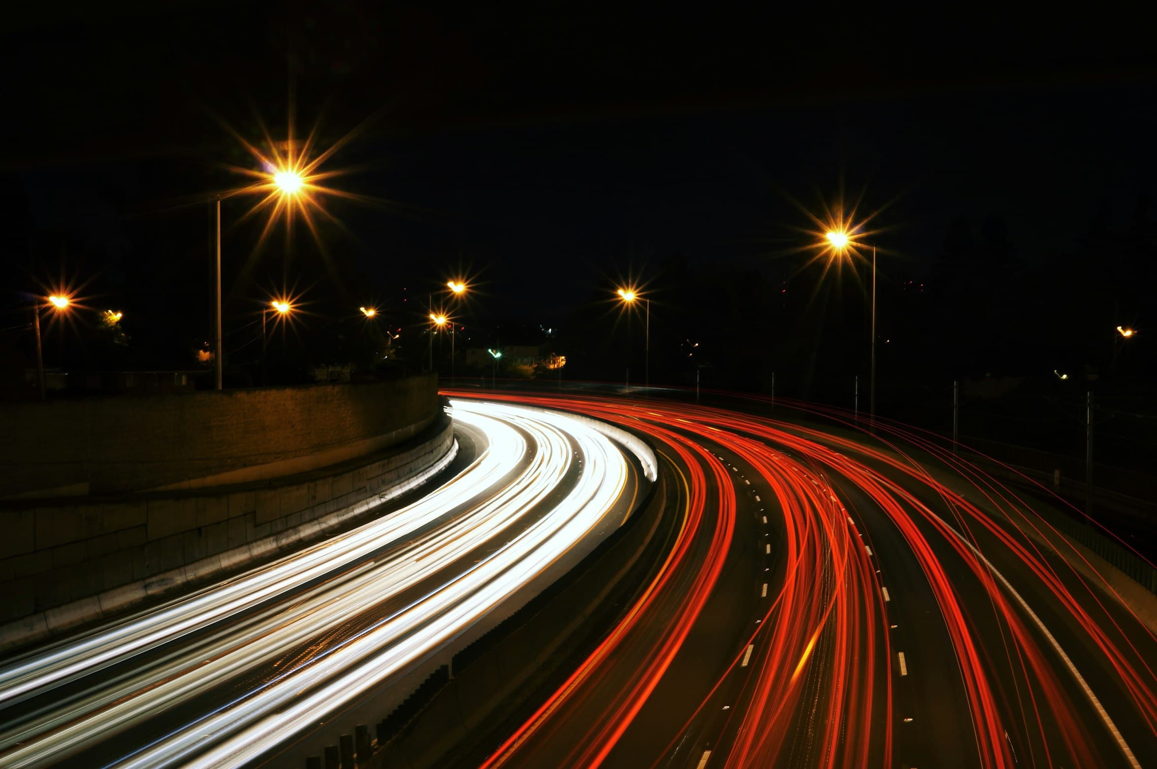 Long exposure light trails representing speed and efficiency